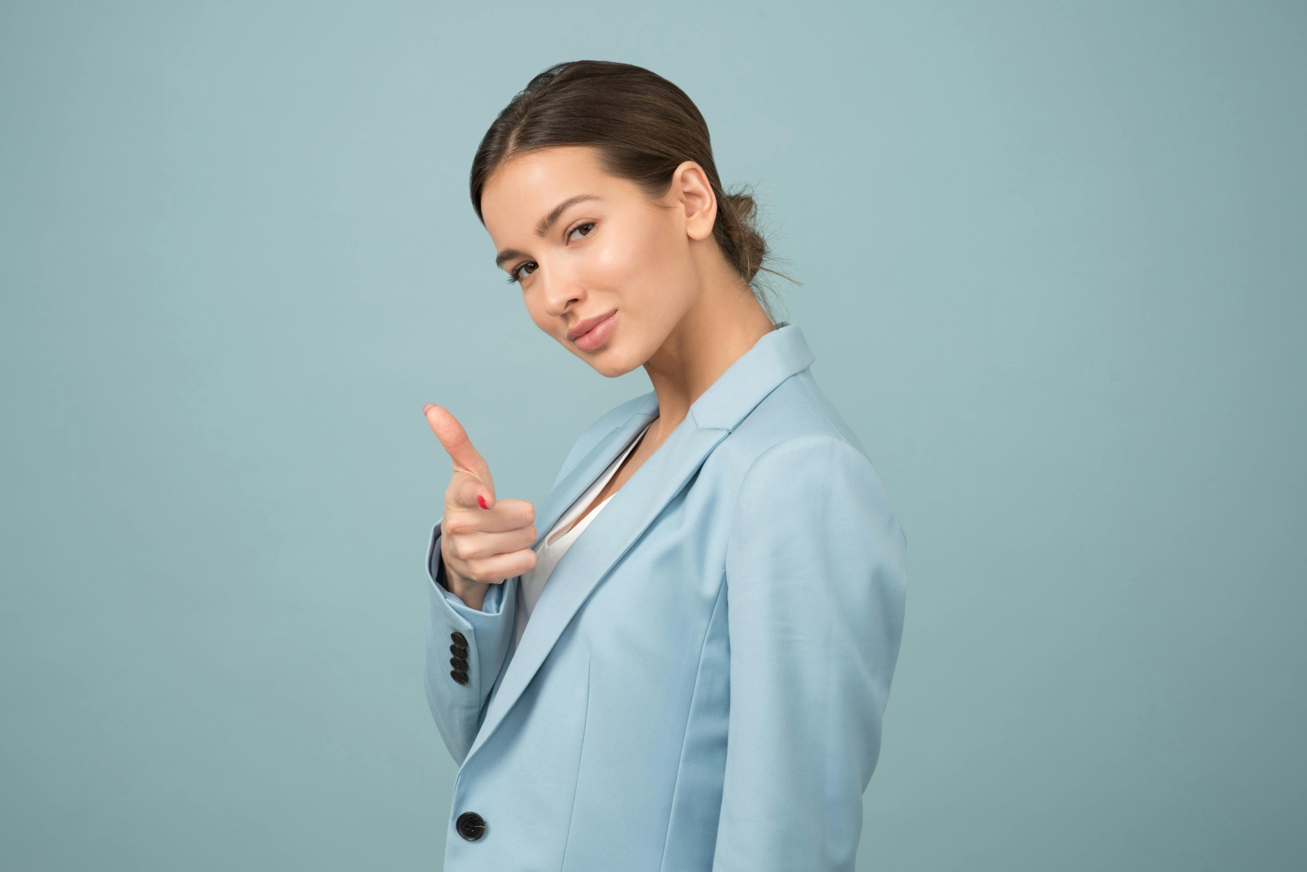 A lady with brown hair and a light blue suit on taking Responsibility